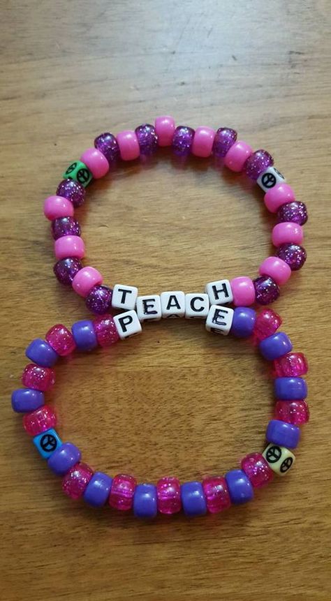 Teach Peace double by LadyRaveicorn - Kandi Photos on Kandi Patterns Double Kandi Bracelet, Festival Kandi Ideas, Edc Kandi Bracelets, Cute Kandi Ideas, Kandi Ideas Words, Rave Kandi Ideas, Rave Candy, Edm Ideas, Music Festival Makeup