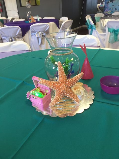 Diy mermaid centerpiece Centerpiece Mermaid Party, Mermaid Center Piece Ideas, Mermaid Tail Centerpiece Ideas, Mermaid Table Centerpieces Diy, Mermaid Centerpieces Diy, Ariel Table Decorations, The Little Mermaid Centerpieces, Mermaid Birthday Centerpieces, Mermaid Centerpiece Ideas Diy