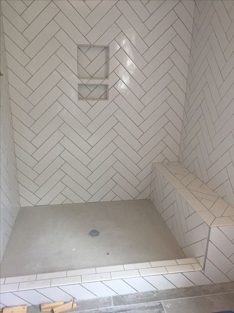 White Subway Tile Patterns Bathroom, White Subway Tile Herringbone Bathroom, Bathroom Shower Tile Ideas Walk In Herringbone Pattern, Herringbone Subway Tile Bathroom, Herringbone Subway Tile Shower Wall, White Herringbone Shower Tile, Pattern Subway Tile, Tile Herringbone Pattern, Herringbone Shower Wall