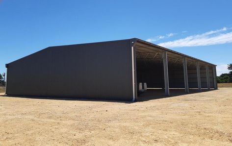 3-sided traditional 40m x 30m Hay Shed recently completed in the South East. This shed can store up to 1500 square bales. Finished in Woodland grey this farm shed will serve its purpose for years to come. #spanlift #HayShed #SouthAustralia #australianmade #ichoosesa #morethanjustashed #structuralshedbuilders #farmshed #ausag #steel #machineryshed #farmsheds Hay Shed, Harvest Storage, Farm Shed, Shed Design, South Australia, Farm Life, The South, Agriculture, Shed