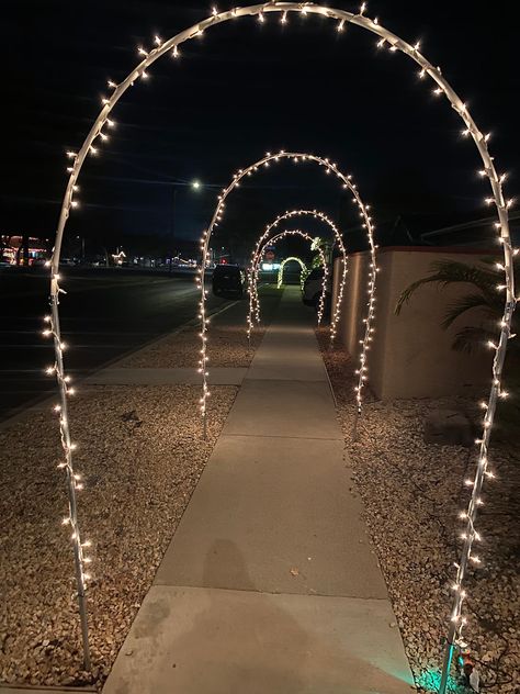 By John GrossiIn-Depth How-to Video: https://youtu.be/Uw5RXWmDiqc For years, a Long Beach local named Tom Donahue, put up these lighted arches in front of his house for the holidays. During the quarantine Christmas of 2020, his neighbor Jeremy Echnoz offered to help get their whole street participating in on the arch fun.About a month later, these arches weren’t just on the whole street, they were in the whole neighborhood! People started visiting from all over Long Beach (and beyond) to walk Sidewalk Archway, Sidewalk Lighting, Christmas Arch, Arch Light, Light Tunnel, Diy Christmas Lights, White String Lights, The Arch, Christmas Crafts Decorations