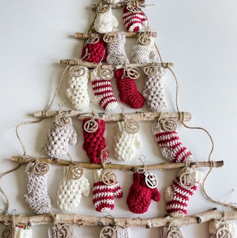 This crochet advent calendar brings a cozy, handmade touch to your holiday season. Featuring a mix of three different mittens and stocking patterns in classic red and cream, each piece is hung on a DIY Christmas tree ladder, ready to be filled with small surprises. There’s also an option to purchase wooden numbers to add to the mittens and stockings to count down to the big day. You can find the pattern for purchase on Etsy. Stocking Ornaments Diy, Advent Calendar Crochet, Mitten Crochet, Crochet Advent Calendar, Advent Calendar Pattern, Homemade Advent Calendars, Puff Stitch Crochet, Crochet Mittens Pattern, Yarn Scraps