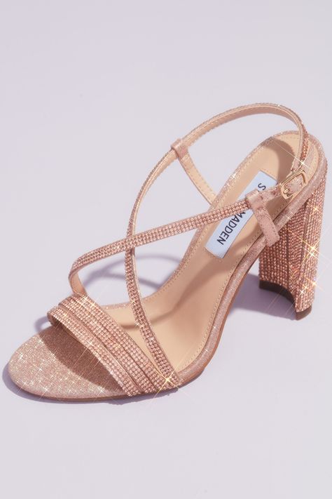 Step out and sparkle in a pair of heels from our exclusive Steve Madden x DB collection! Strut your way down the aisle in this all over crystal embellished pair of strappy pumps. This heel combines some of the most on-trend detail at the moment like a chic block heel, and a slightly squared-off toe inspired by heels of the 90s and 2000s. | Style SHIRAH | Shop the designer wedding shoes collection in select David’s Bridal locations or online at davidsbridal.com | #stevemaddenshoes #weddingshoes Brown Pumps Heels, Strappy Wedding Shoes, Lace Up Sandal Heels, Ankle Tie Heels, Gold Strappy Sandals, Metallic High Heels, Rose Gold Heels, Bridal Wedding Shoes, Steve Madden Heels