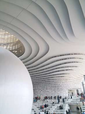 TIANJIN, CHINA Tianjin Binhai Library The beautiful swirling shelves are lined with thousands of fake books. Tianjin Binhai Library, Futuristic Library, Beautiful Library, Library Architecture, Bubble Design, City Library, Santiago Calatrava, Tianjin, Architecture Portfolio