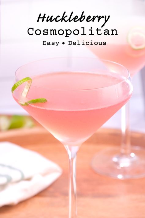 A fun and fancy cocktail recipe made with huckleberry vodka.  This huckleberry cosmopolitan is the perfect combination of sweet and tart, and it's also absolutely mouthwatering. Betcha can't drink just one! #cosmopolitancocktail #huckleberryvodka #huckleberrycocktail Huckleberry Recipes Drinks, Huckleberry Martini Recipe, Elderfashion Cocktail, Huckleberry Vodka Cocktails, Huckleberry Cocktails, Huckleberry Martini, Fancy Cocktail Recipes, Fancy Cocktails Recipes, Cosmopolitan Recipe