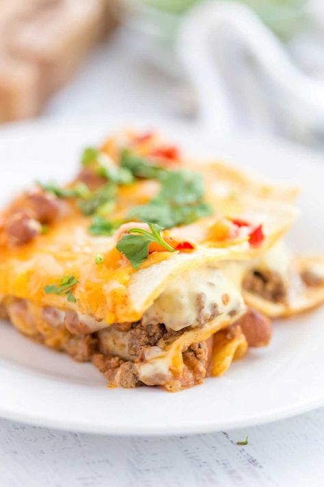 Mexican Lasagna with stacked tortillas, seasoned ground beef, beans, Rotel tomatoes, and cheese! Cheese Enchilada Casserole, Cream Cheese Enchiladas, Mexican Lasagna Recipes, Taco Lasagna, Mexican Lasagna, Cheese Enchiladas, Mexican Tacos, Czech Recipes, Colby Jack