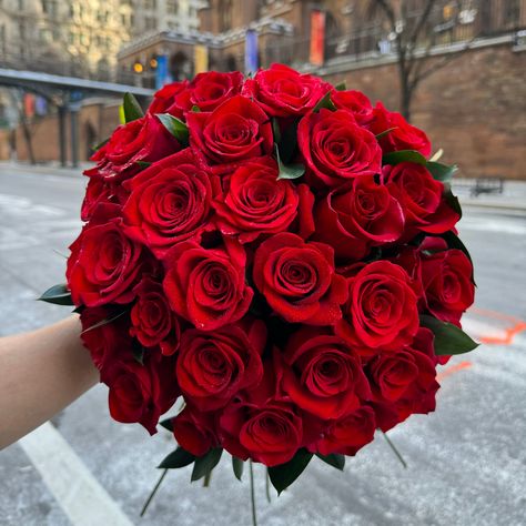 A stunning and chic hand tied bouquet of red roses. Perfect for a date, special occasion, anniversary, or just because! Choose from 3 Dozen Roses, 2 Dozen Roses & 15 Roses