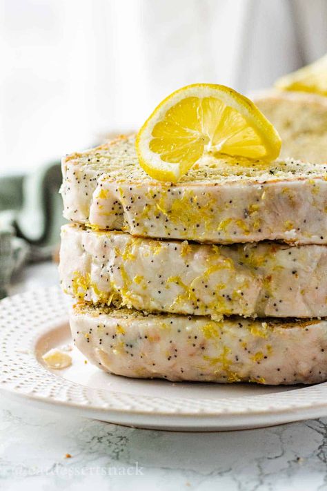 This Lemony Zucchini Bread recipe is filled with zesty lemon, lovely crunchy poppyseeds, fresh zucchini, and lemon glaze on top. Lemon Poppy Seed Zucchini Bread, Zucchini Desserts, Zucchini Recipes Dessert, Lemon Zucchini Bread, Strawberry Banana Bread, Lemon Poppyseed Bread, Fresh Zucchini, Lemon Zucchini, Zucchini Bread Recipe