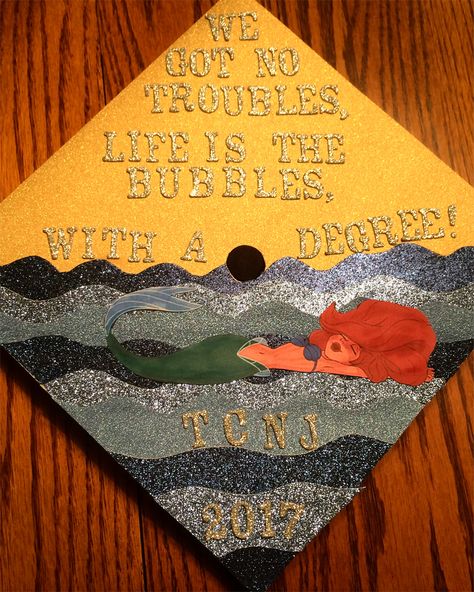 Little Mermaid graduation cap! Found the idea on Pinterest and made my own version. Little Mermaid Graduation Cap, Mermaid Graduation Cap, Little Mermaid Decorations, Cap Inspiration, Graduation Cap Designs College, Disney Graduation Cap, Disney Graduation, Grad Cap Decorated, Masters Graduation