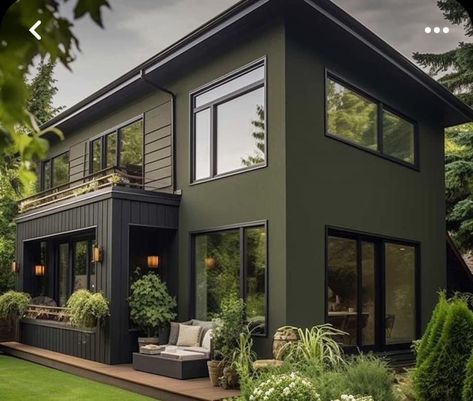 Olive Color House Exterior, Jade Green House Exterior, Exterior Green House Paint, Olive Green House Exterior Ideas, Earthy Green Exterior Paint Colors, Modern Home Exterior Color Schemes, Dark Green Exterior House With Natural Wood Elements, Green And Black Exterior House, Black House Green Trim