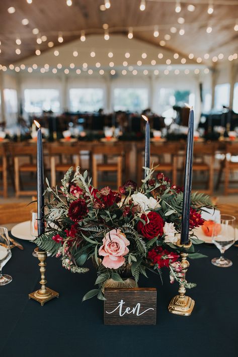 Burgundy And Black Floral Arrangements, Black And Maroon Centerpieces, Fall Wedding Round Table Settings, Moody Winter Wedding Centerpieces, Classy Moody Wedding, Moody Wedding Table Setting Round, Dark Moody Centerpieces, Moody Romantic Table Decor, Maroon And Black Wedding Table Decor