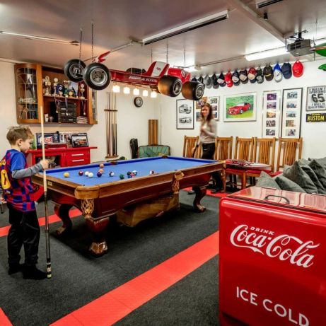 Pool table area in this multi-use garage Pool Table In Garage Ideas, Pool Table Garage, Pool Table In Garage, Garage Pool Table Room, Pool Table Arcade Room, Pool Table In Barn, Red Pool Table, Pool Table Room, Cool Garages