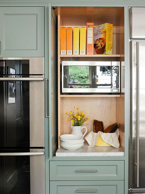 Slide-back doors keep microwave accessible while also having the option to conceal it for a clean look. Hidden Microwave, Microwave Cabinet, Appliance Garage, Hidden Kitchen, Pantry Cabinet, Trendy Kitchen, Kitchen Remodel Idea, Kitchen Pantry, Small Appliances