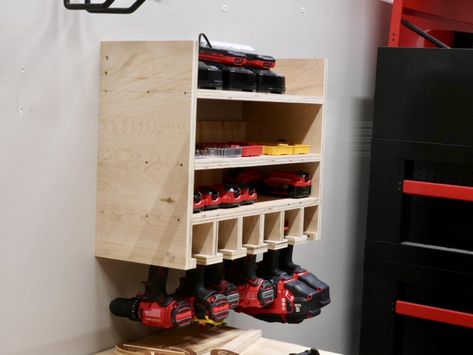 I found a great, simple design from Amy over at Her Tool Belt, which I’ll link to in the video description, and I just modified it slightly for my needs and to use up the plywood scraps I had on hand. 2x4 Workbench, Drill Charging Station, Tool Organization Diy, Battery Charging Station, Workbench Organization, Drill Storage, Organized Garage, Building A Workbench, Power Tool Storage