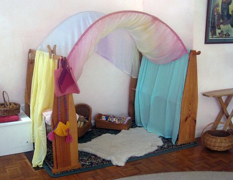 On returning to our Waldorf playgroup We were greeted with a beautiful surprise! A gorgeous rainbow canopy… otherwise known as a playstand arch *smile* The wonderful space drew us in immediately… children and adults alike And take a look at how it is made what clever playgroup leaders! They added some wood to each end which included a space for dowel to slot A perfect fix for playstands of differing heights and such an affordable way to create delight! Happy days,Kelly Waldorf Playstand, Communication Friendly Spaces, Rainbow Canopy, Natural Playscapes, Canopy Diy, Waldorf Preschool, Waldorf Play, Waldorf Homeschooling, Waldorf Steiner