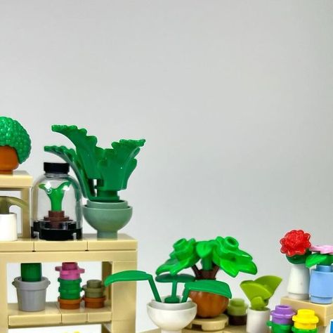 Jesse on Instagram: "Plant Shop 🌱 Here are most of the interior builds for my upcoming plant store 🪴 Including a wide range of merchandise like a terrarium, chia pet, succulents, venus flytrap, cacti, terracotta pots, and more! Which is your favorite? 🌵🌿🌼 . . . . #lego #afol #plant #plantshop #legomoc #legomodular #modular #plantlover #legocity #legotown #plants #legostore #venusflytrap #chia #terrarium #legoshop #legohouse #minifig #farmersmarket #legocreator #legofurniture #legobuilding #seeds" Chia Terrarium, Lego Plant Pot, Lego Terrarium, Lego Botanical, Lego Plants, Mini Creations, Lego Diy Crafts, Lego Masters, Lego Techniques