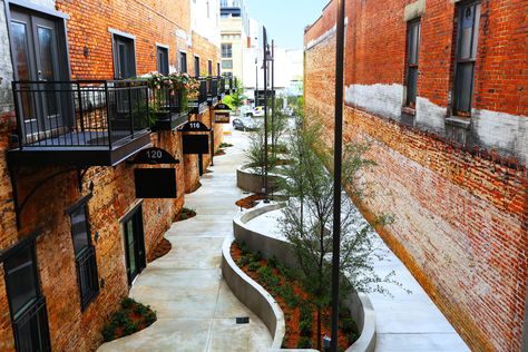 Alleyway Design, Alley Design, Urban Spaces Design, Narrow Street, Concrete Retaining Walls, Planter Beds, General Mills, Parking Design, Stained Concrete