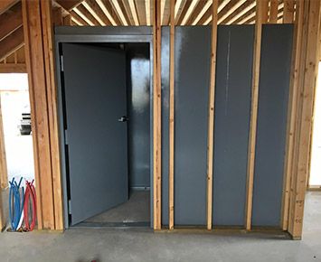 Safe Room Ideas In House, Hidden Storm Shelter Safe Room, Built In Safe Room, Hidden Storm Shelter, How To Build A Safe Room, Safe Room Ideas Storm Shelters, Small Safe Room Ideas, Safe Rooms In Houses Storm Shelters, Fireproof Safe Room