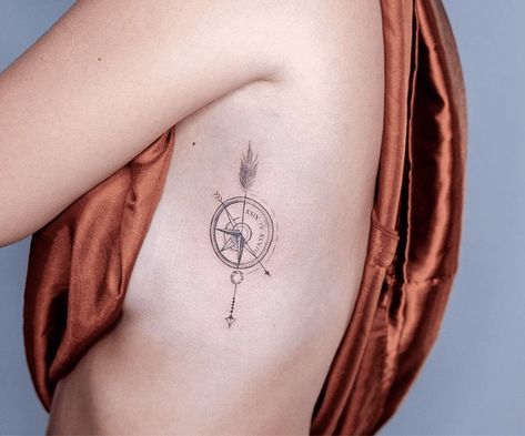 30 Gorgeous Takes on the Classic Compass Tattoo Minimalist Compass Tattoo Men, Creative Compass Tattoo, Compass With Dates Tattoo, Compass Arrow Tattoo Feminine, Native American Compass Tattoo, Half Compass Tattoo, Cross Compass Tattoo, Compass Sternum Tattoo, Compass Dreamcatcher Tattoo