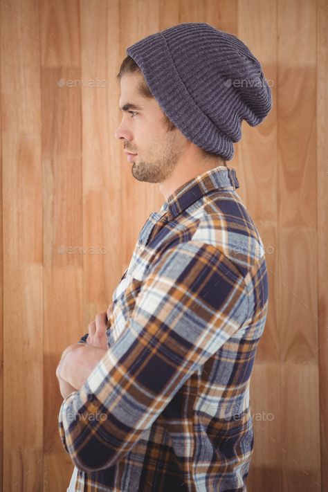 Side view of confident hipster with arms crossed standing against wooden wall by Wavebreakmedia. Side view of confident hipster with arms crossed standing against wooden wall#hipster, #arms, #confident, #Side Arms Crossed Over Chest Reference, Hands On Hips Side View, Arms Crossed Side View Drawing, Arms Crossed Side View, Man Arms Crossed Reference, Guy With Arms Crossed, Hand Behind Back Pose, Person Standing With Arms Crossed, Sitting Pose Reference Side View