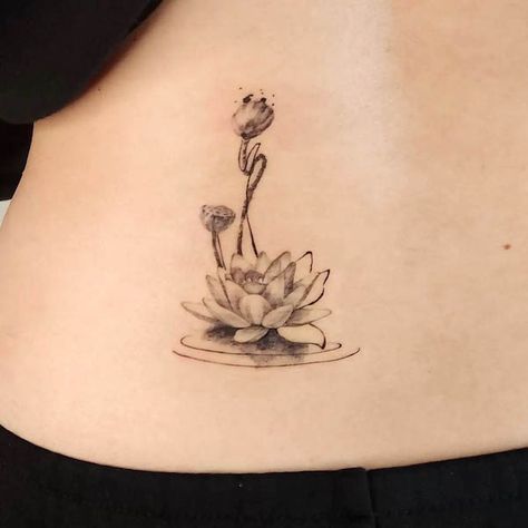 63 Soulful Lotus Tattoos with Meaning - Our Mindful Life Real Lotus Flower Tattoo, Lotus Pod Tattoo, Water Lily With Lily Pad Tattoo, Indian Lotus Tattoo, Black Lotus Tattoo Design, Water Lily And Dragonfly Tattoo, Lotus And Water Tattoo, Lotus In Water Tattoo, Lotus Flower Tattoo Side Ribs