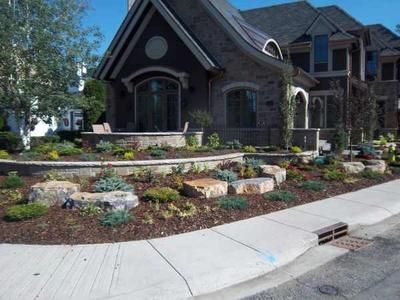 Corner lot landscaping design is a little different than a normal street lot, as your property now includes an additional 90 degrees of vision. note how the stone wall flows with the curver corner. Corner Lot Landscaping, Landscaping Walls, Corner Landscaping, Tree Landscaping, Landscaping Rocks, Terraced Garden, Tortoise Habitat, Side Yards, Dream Yard