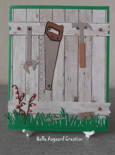 Green card base with greyish wood design paper in vertical pattern attached. Two planks attached horizontal with half beads left and right to image wooden fence. Die cut tools attached on to upper plank with half beads for nails. One tool laying in die cut grass below on card front. Die cut small branches with tiny redish beads attached. Green, light grey and brown colour variations, black and red colours. Fence Cards Ideas, Fence Cards, Masculine Cards Handmade, Vertical Pattern, Diy Fence, Design Paper, Wooden Fence, Green Cards, Brown Colour