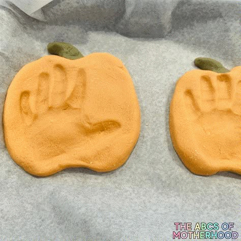 fall pumpkin salt dough clay craft Pumpkin Salt Dough Handprint, Salt Dough Recipe Pumpkin, Clay Pumpkin Keepsake, Salt Dough Pumpkin Keepsakes, Salt Dough Ornaments Halloween, Infants Arts And Crafts Fall, Halloween Clay Handprints, Salt Dough Pumpkins, Salt Dough Crafts Halloween