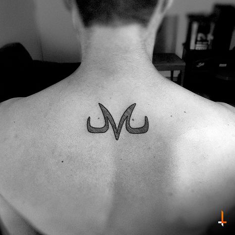 Nº93 Majin Buu #tattoo #dragonball #dragonballz #majinbuu #letterm #m #animetattoo #filledwithlines #bylazlodasilva right between the birth marks ·M· Small Dragon Ball Tattoo, Majin M Tattoo, Small Dbz Tattoo, Small Dragonball Tattoo, Majin Tattoo Ideas, Majin Symbol Tattoo, Dbz Tattoo Ideas, Majin Buu Tattoo, Dragonball Z Tattoo