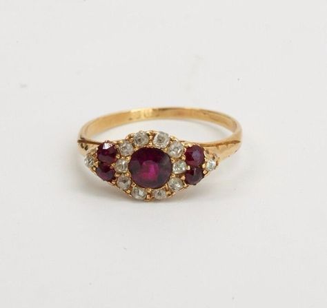 This is a 2.2 Gram 15K Yellow Gold Vintage Mid-Victorian Era Superb Delicate Ruby and Diamond Ring, Circa 1870. Size 6.75.  It is pre owned but shows little if any wear.  Stock # BB32R34 This listing contains photographs of the actual item you will receive.  Our items are in excellent condition with little or no signs of wear and many are one of a kind pre-owned estate finds.   Please look closely at the pictures in this listing as they are part of the product description. Please read the description, as any imperfections or condition comments will be included.  We do our best to accurately describe the condition of each piece and encourage you to ask questions prior to purchase.  Due to a large number of unqualified returns, we will be charging a 20% restocking fee. If for some reason, th Regency Engagement Ring, Victorian Oval Ruby Ring, Victorian Ruby Ring With Rose Cut Diamonds, Victorian Ruby Ring With Center Stone, Victorian Ruby Ring For Wedding, Victorian Ruby Cluster Ring For Wedding, Victorian Hallmarked Round Ruby Ring, Victorian Hallmarked Ruby Ring, Victorian Red Cluster Ring For Wedding