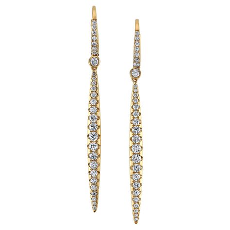 These gorgeous 18k yellow gold and diamond pave dangling earrings feature 1.31 carats of sparkling round brilliant cut diamonds! The elongated, linear design is so flattering and chic, they'll bring streamlined elegance and style to any outfit! Undeniably perfect for evening wear, these earrings can easily be worn with a crisp, white collared shirt or black sweater for an ultra-sophisticated daytime time look as well. Whether for yourself or to give to a loved one, these versatile earrings will White Collared Shirt, Bridal Diamond Jewellery, Dangling Earrings, Fine Jewelry Collection, Round Brilliant Cut Diamond, Brilliant Cut Diamond, Pave Diamonds, Evening Wear, Round Brilliant