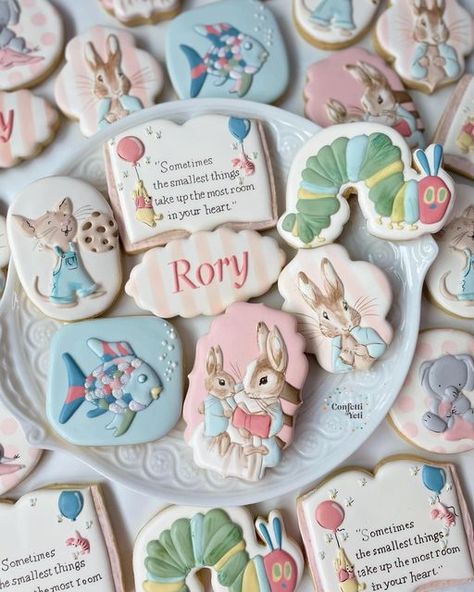 Kerstyn Lott on Instagram: "I love a nursery book theme for baby showers. I still remember falling in love with characters, and learning life lessons from them.  We did many of the classics in soft pastels for sweet little Rory on the way. Peter Rabbit, Winnie the Pooh, Rainbow Fish, The Hungry Caterpillar, and If You Give A Mouse A Cookie; and also a cute little elephant for the Alabama mama.  #babyshowercookies #bookcookies #bookbabyshower #peterrabbitcookies #winniethepoohcookies #confettiyeticookies" If You Give A Mouse A Cookie Baby Shower Theme, Storybook Baby Shower Cookies, Book Baby Shower Cookies, Nursery Rhyme Baby Shower Theme, Storybook Cookies, Rabbit Winnie The Pooh, The Hungry Caterpillar, Bebe Shower, Mouse A Cookie