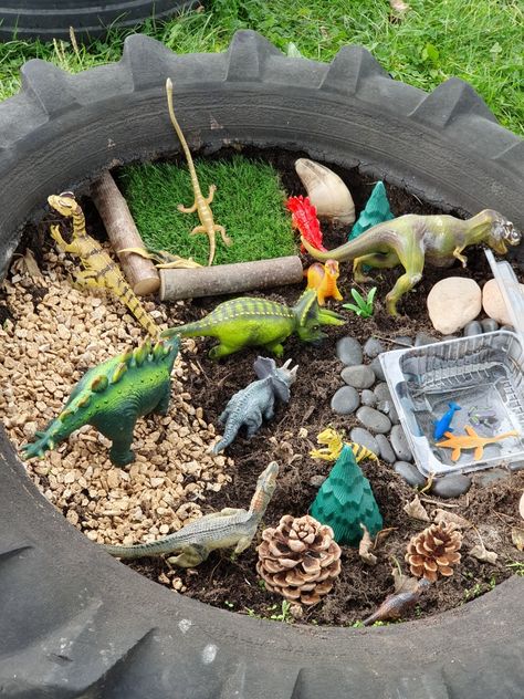 Preschool Small World Area, Dinosaur Garden Ideas, Outdoor Small World, Sensory Garden For Kids, Small World Area, Dinosaur Small World, Dinosaur Garden, Outdoor Learning Spaces, Dinosaur World