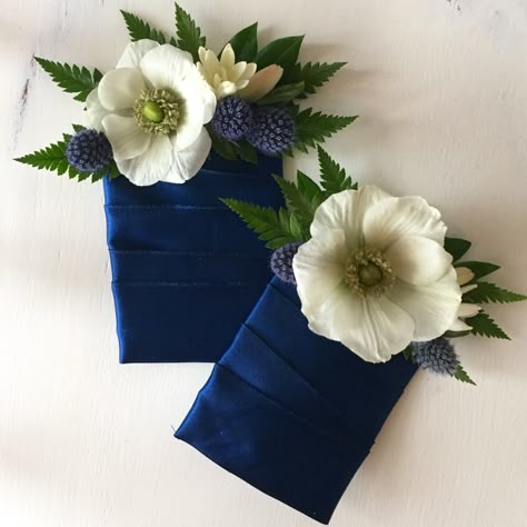 Woodsy Alpine wedding with peach garden roses and white anemones. Pocket boutonnieres #wedding #thistle #peach #navyblue #bouquet Boutonniere For Men, Pocket Boutonniere Anemone, Wedding Floral Pocket Square, Boutineer Ideas Pocket, Pocket Bouteniers, Wedding Boutineers Pocket, Small Pocket Boutonniere, Alternative Boutineer Ideas, How To Make A Pocket Square Boutonniere