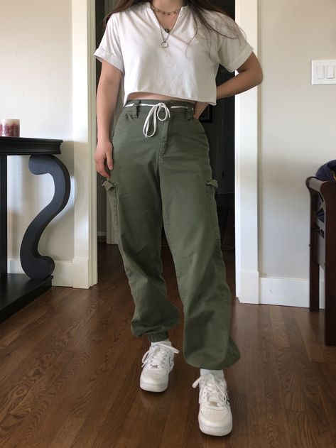 Green cargo pants with white crop top, layered necklaces Aesthetic Green Cargo Pants Outfit, Women Cargo Joggers Outfit, Cargo Pants Outfit Olive Green, Green Cargo Pants White Top, Olive Green Sweatpants Outfit, Olive Green Pants Outfit Aesthetic, Midsize Cargo Pants Outfit, Green High-waisted Cargo Pants, Green Pants White Top