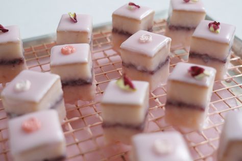 Petit fours were one of the first recipes I dreamt of baking—but they somehow seemed pretty daunting, even once I’d tackled layered and tiered cakes. Eventually, I learned some of the ins and outs of this classic style that has seemingly fallen a bit out of fashion. Once I started, I couldn’t stop—and I’m truly not sure why these cakes aren’t a common baking project anymore. They are as practical as they are adorable for sweet lovers and entertainers alike. The one-to-two bite-size cakes are ... Cake Petit Fours, Petit Fours Recipe, Poured Fondant, Petit Four Recipes, Garden Party Tea, Strawberry Rose, Strawberry Roses, 2023 Recipes, Strawberry Jelly