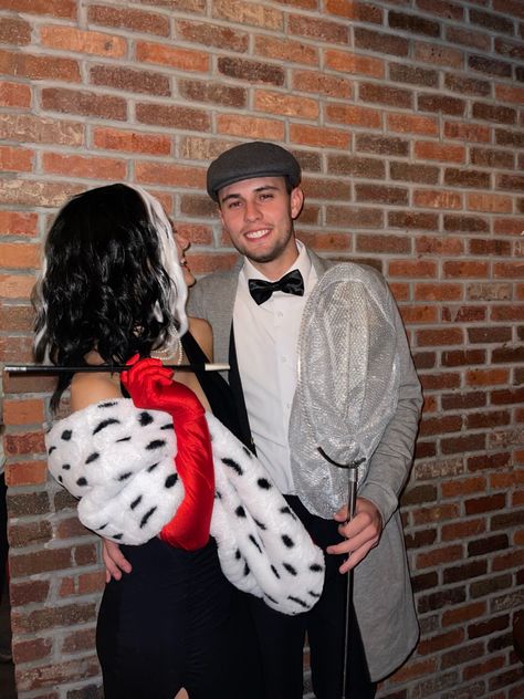 Couple Costumes Cruella, Couple Plus Dog Halloween Costume, Cruella And Dog Catcher Costume, Cruella And Dalmation Costume Couple, Halloween Cosplay Couple, Cruella Couple Costume, Cruella And Dalmation Costume, Cruella Deville Costume Couple, Cruella Costume Ideas