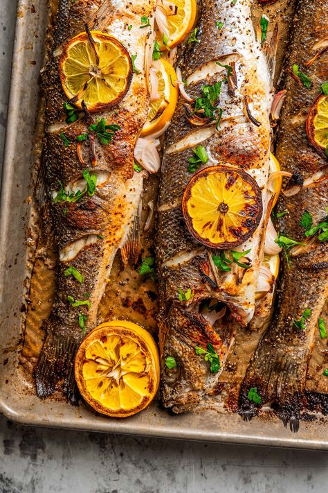 This roasted branzino recipe is a must-try. A whole branzino is seasoned with salt and pepper, stuffed with shallots and lemon slices, and roasted to flaky perfection. And it's all done in 20 minutes! Whole Branzino Recipe Baked, Branzino Side Dishes, Baked Branzino Recipe, Whole Branzino Recipe, Branzino Fish Recipe, Roasted Branzino Recipe, Branzino Fish, Whole Branzino, Roasted Branzino