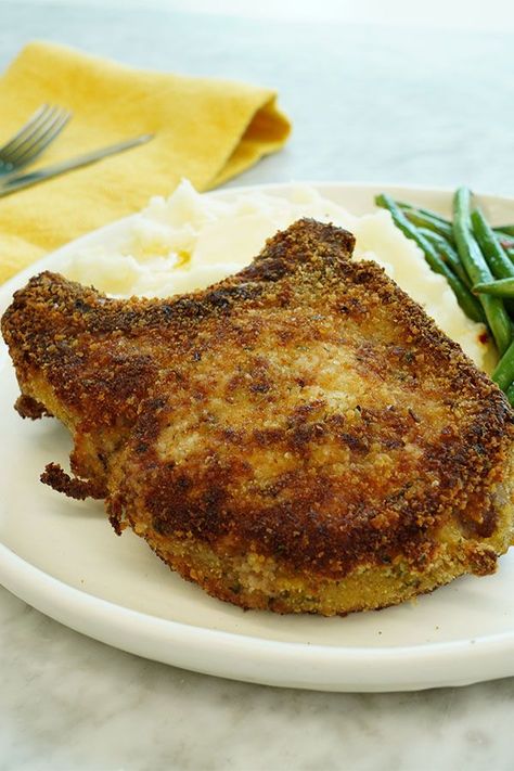 This crispy breaded pork chops recipe is a quick and easy dinner recipe! This simple pork chop dish incorporates bread crumbs, olive oil, and seasonings. You will love cooking these juicy, tender pork chops for a weeknight dinner! Breaded Pork Chops Baked, Pork Chops Bone In, Breaded Pork Chops, Pork Chop Recipes Baked, Tender Meat, Fried Pork Chops, Pork Loin Chops, Pork Ham, Seasoned Bread Crumbs