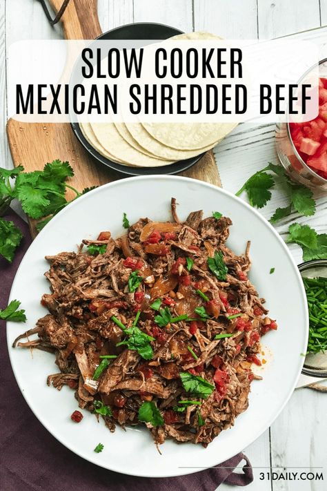 Slow Cooker Mexican Shredded Beef is fall-apart-tender, braised in a somewhat spicy tomato-chipotle sauce, that makes amazing tacos. Or whatever else your heart desires. Slow Cooker Mexican Shredded Beef Tacos | 31Daily.com #mexican #beef #slowcooker #shreddedbeef #tacos #tacotuesday #31Daily Mexican Shredded Beef Tacos, Slow Cooker Mexican Shredded Beef, Shredded Beef Recipes, Slow Cooker Mexican, Shredded Beef Tacos, Mexican Shredded Beef, 31 Daily, Mexican Shredded Chicken, Taquitos Recipe