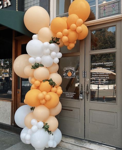 Orange, white and blush balloon garland with greenery added Shades Of Orange Balloon Garland, Orange And Sage Balloon Garland, Pastel Orange Balloon Garland, Light Orange Party Decorations, Blue Orange White Balloon Arch, Yellow Orange Party Decor, Cuties Birthday Party, Orange And White Balloon Garland, Balloon Garland Orange