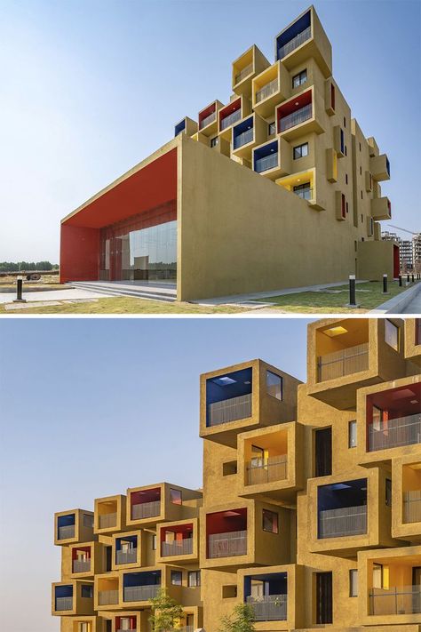 A composition of coloured cuboids create this sculptural residential project. The brief for these mid-rise buildings was to create studio apartments, a hostel & a guest house on the perimeter of a housing project for a residential township, to house the working people of a new cement plant. #architonic #architecture #archilovers #building #residentialbuilding #buildingdesign #apartments #hostel #guesthouse Sanjay Puri Architects, Sanjay Puri, Hostel Room, Exhibition Building, Minecraft City, Houses Apartment, Architecture Graphics, Trade Fair, Studio Apartments