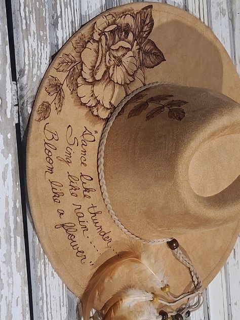 Dance like thunder, sing like rain.....  Hand drawn and burned art on vegan suede rancher.  https://fanciipantz.etsy.com/listing/1733326213 Western Wood Burning Ideas, Custom Hat Ideas, Hat Burning Ideas, Burning Hats, Burned Hats, Hat Burning, Cowboy Hat Design, Custom Cowboy Hats, Hat Decor