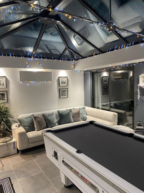 Pool table extensions are a great way to add value to your home. 5 Star designs and builds breathtaking orangeries and single storey pool table extensions that can be enjoyed by all the family. Lighting pelmets, skylights and sleek bi-fold doors help complete the winning look. #orangery #pooltable #homeinspo #fairylights #slidingdoors Pool Table Front Room Ideas, Garden Games Room And Bar, Game Room Sunroom, Black Conservatory Interiors, Conservatory Games Room, Outdoor Games Room, Orangery Extension Interiors, Pool Table In House, Conservatory Bar Ideas