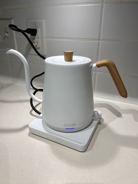 Ecuze Gooseneck Electric Kettle for hot water, coffee, tea, and more. Beautiful white design with a wood handle. It works very fast and does not take up a lot of space on the counter. The only downside is it is a little loud when in use (to me). #kettle #fallhomedecor #tea #coffee #fall #kitchengadgets #winter #white School Apartment, White Kettle, Cooking Ware, Coffee Fall, Gooseneck Kettle, Apartment Goals, Water Kettle, Dream House Rooms, Pour Over Coffee