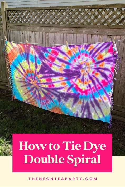 Colorful tie dye towel pinned on a clothesline 3 Color Tie Dye Patterns, Tie Dye Blanket Patterns, Tie Dye Blanket Diy Patterns, Tie Dye Patterns Diy Tutorials, Tie Dye Sheets Diy Patterns, Diy Tie Dye Sheets, Swirl Tie Dye Technique, Tie Dye Beach Towel Diy, Spiral Tie Dye How To