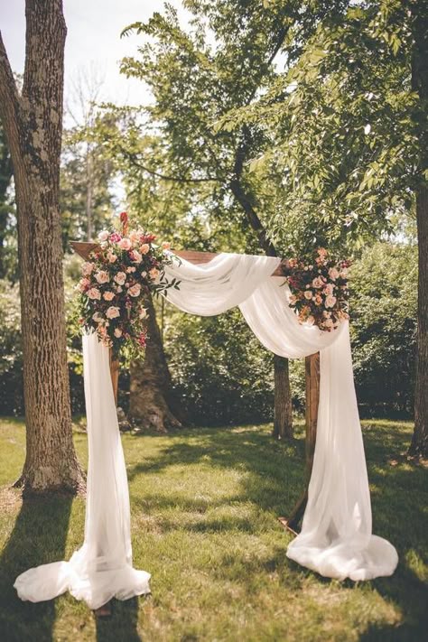 WOW this is absolutely stunning.  This outdoor wedding had a very romantic wooden archway with load of draping fabric and pink flowers. #weddingarch #weddingarchideas #romanticweddingceremony #weddingarchflowers Wedding Setup, Wedding Archway, Romantic Wedding Ceremony, Wedding Arch Flowers, Wedding Arbour, Diy Outdoor Decor, Outdoor Wedding Decorations, Wedding Ceremony Decorations, Wedding Places