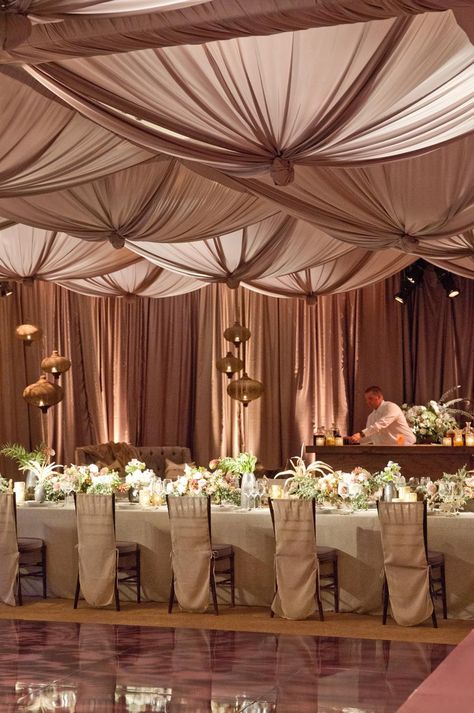 There's this powerhouse duo that kills it in the wedding world. That designing and floral artistry twosome better known as Lisa Vorce  and Mindy Rice  have a way of creating the most magical affai... Ceiling Swag Draping, Draped Ceiling, Neutral Pallet, Ceiling Drapes, Wedding Draping, Wedding Ceiling, Ceiling Draping, Elegant Wedding Centerpiece, Elegant Wedding Reception