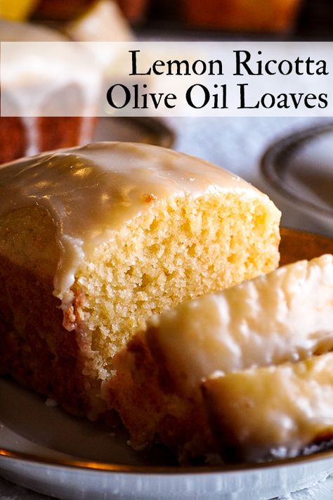 These delicious little Lemon Ricotta Olive Oil Loaves are impossibly moist and tender, with a bright lemon flavor and sweet-tart lemon glaze. #lemonbread #lemonloaves #lemoncake #oliveoil #cake #loaf | ofbatteranddough.com Baking With Yogurt, Olive Oil Cake Recipe, Lemon Olive Oil Cake, New Year's Desserts, Lemon Bread, Oil Cake, Slow Cooker Desserts, Olive Oil Cake, Lemon Ricotta