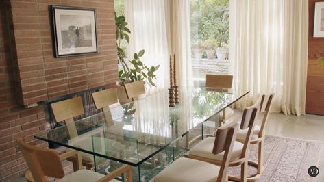 Dakota Johnson House, Meet Me In The Afterglow, Dining Table Mid Century, Pierce Ward, Johnson House, Famous Houses, Glass Dining Table, Mid Century Modern House, Dakota Johnson